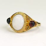 9ct yellow gold opal and garnet trilogy ring, one oval opal cabochon measuring 10mm x 8mm, even