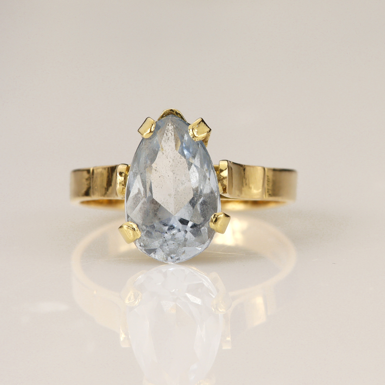 Yellow gold (tests 18ct) synthetic spinel solitaire ring, pear mix cut measures 11.9mm x 7.7mm, claw