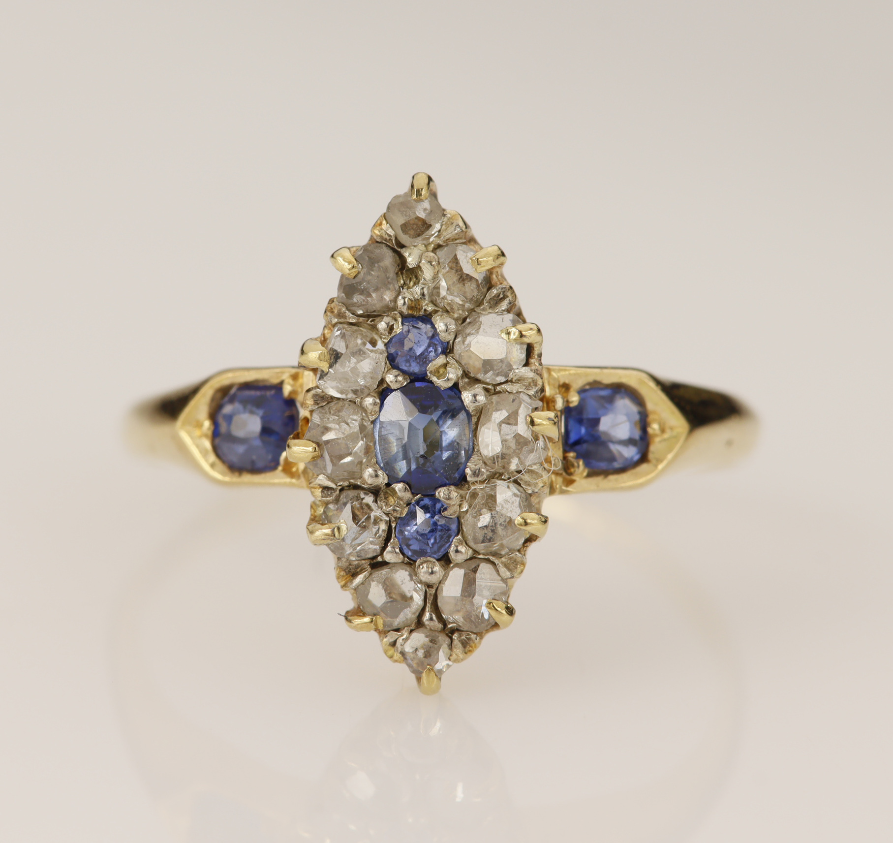 Yellow gold (tests 15ct) antique diamond and sapphire navette ring, central oval mixed cut