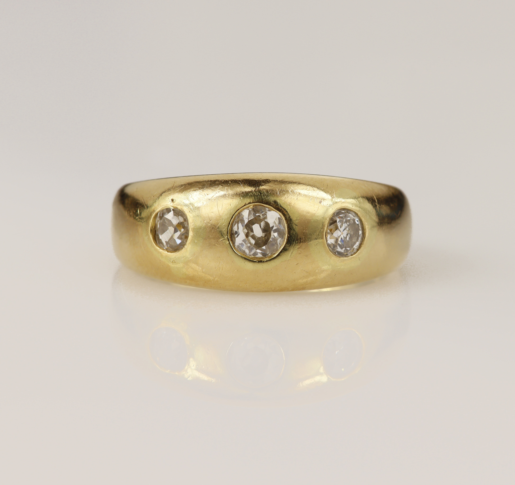 Yellow gold (tests 18ct) Victorian diamond gypsy ring, set with three graduating old cut diamonds,