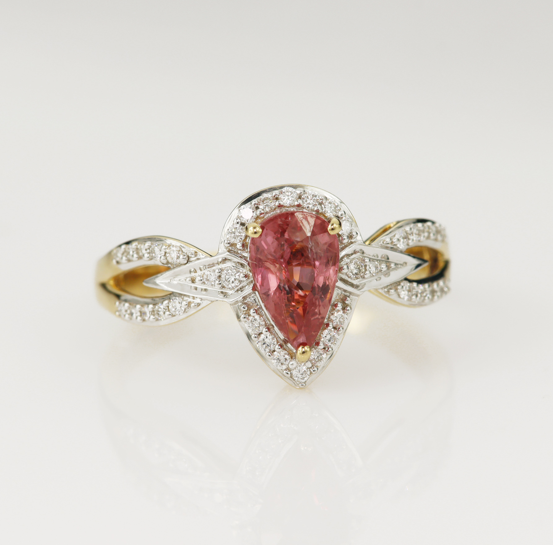 18ct yellow gold padparadscha sapphire and diamond dress ring, one pear cut padparadscha measuring