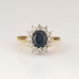 18ct yellow gold diamond and sapphire cluster ring, oval cut 8mm x 6.8mm sapphire weight approx 1.