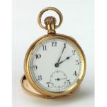 Gents gold plated open face pocket watch in a Dennison star case. The white dial with black arabic