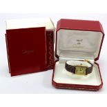 Ladies gold plated on silver Must De Cartier Tank quartz wristwatch. Purchased 1997. Complete with
