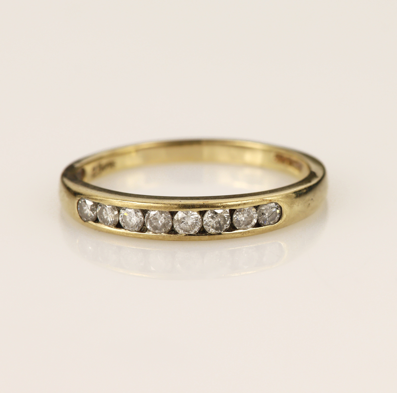 9ct yellow gold half eternity ring, set with eight round brilliant cut diamonds total weight