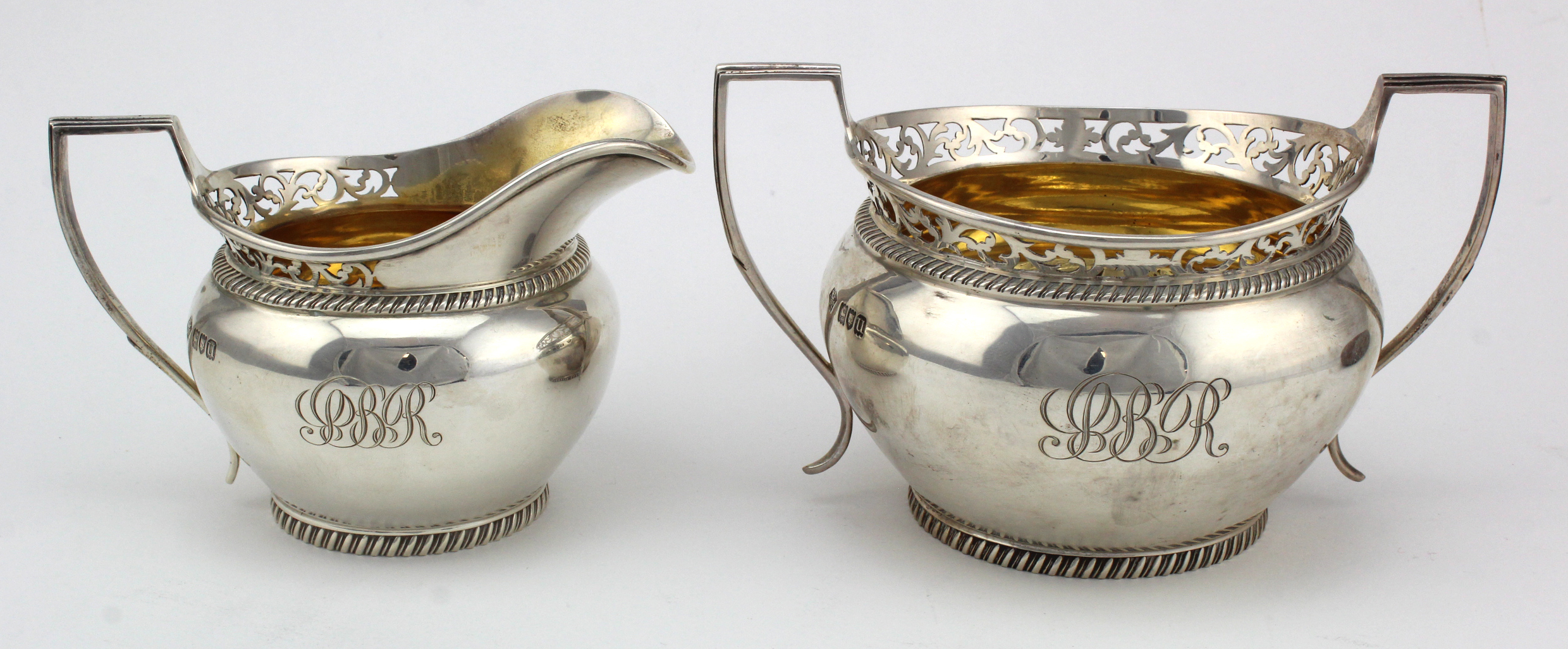 Silver sugar bowl and cream jug, gilt lined, hallmarked 'W.L&Sns, London 1915, sugar bowl width 16.