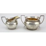 Silver sugar bowl and cream jug, gilt lined, hallmarked 'W.L&Sns, London 1915, sugar bowl width 16.