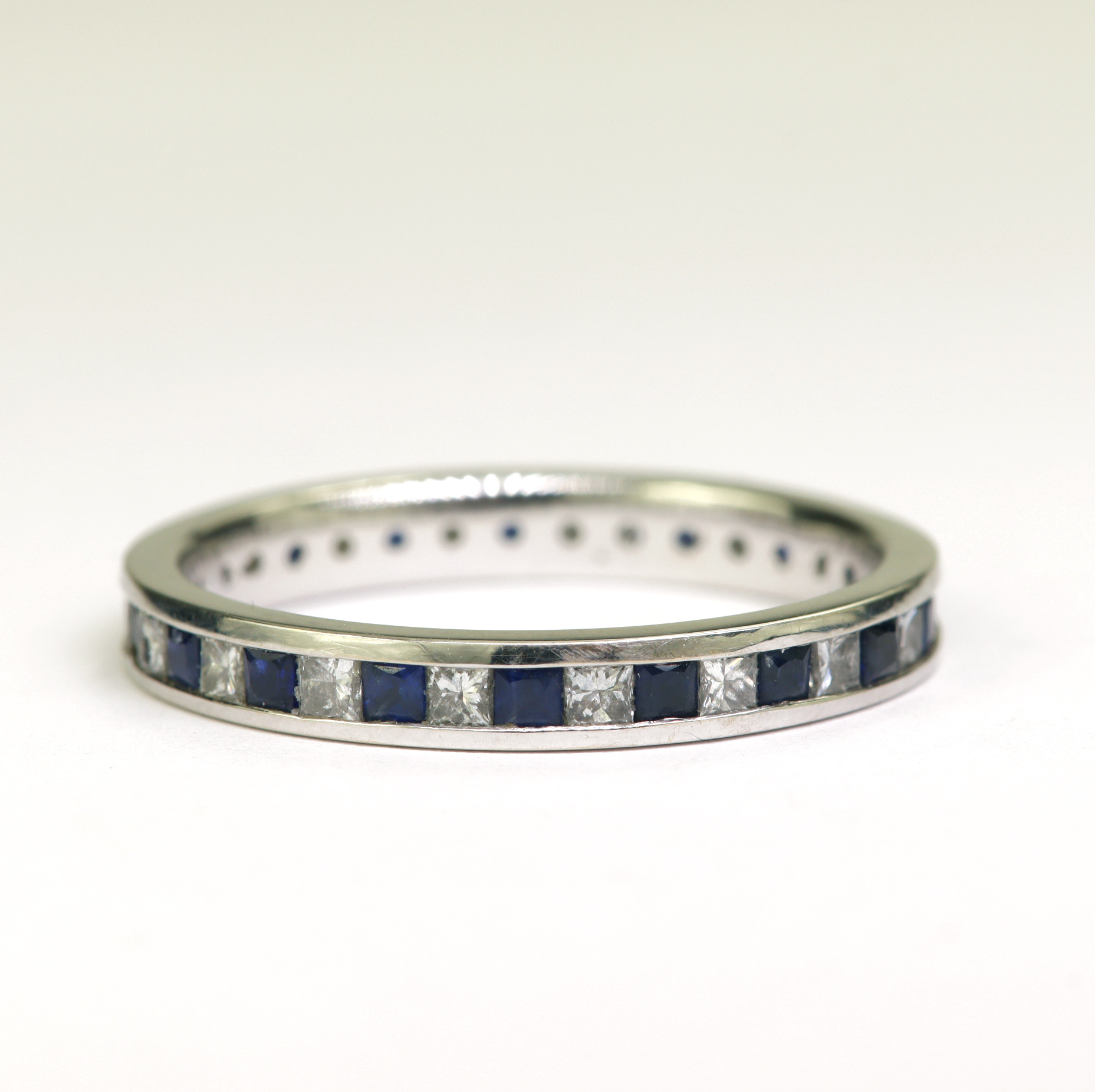 18ct white gold Abelini sapphire and diamond full eternity ring, set with eighteen princess cut