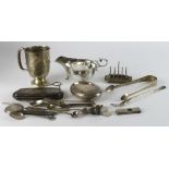 Silver. A collection of various silver hallmarked items, including sauce boat, mug, compact, spoons,