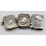 Three engraved silver Edwardian vesta cases, various makers & dates. Total weight of three items