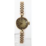 Ladies 9ct cased Omega manual wind wristwatch, on a 9ct bracelet (hallmarked London 1958). Watch
