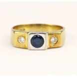 Yellow gold (tests 18ct) diamond and sapphire trilogy ring, round sapphire measures 4.5mm, flanked