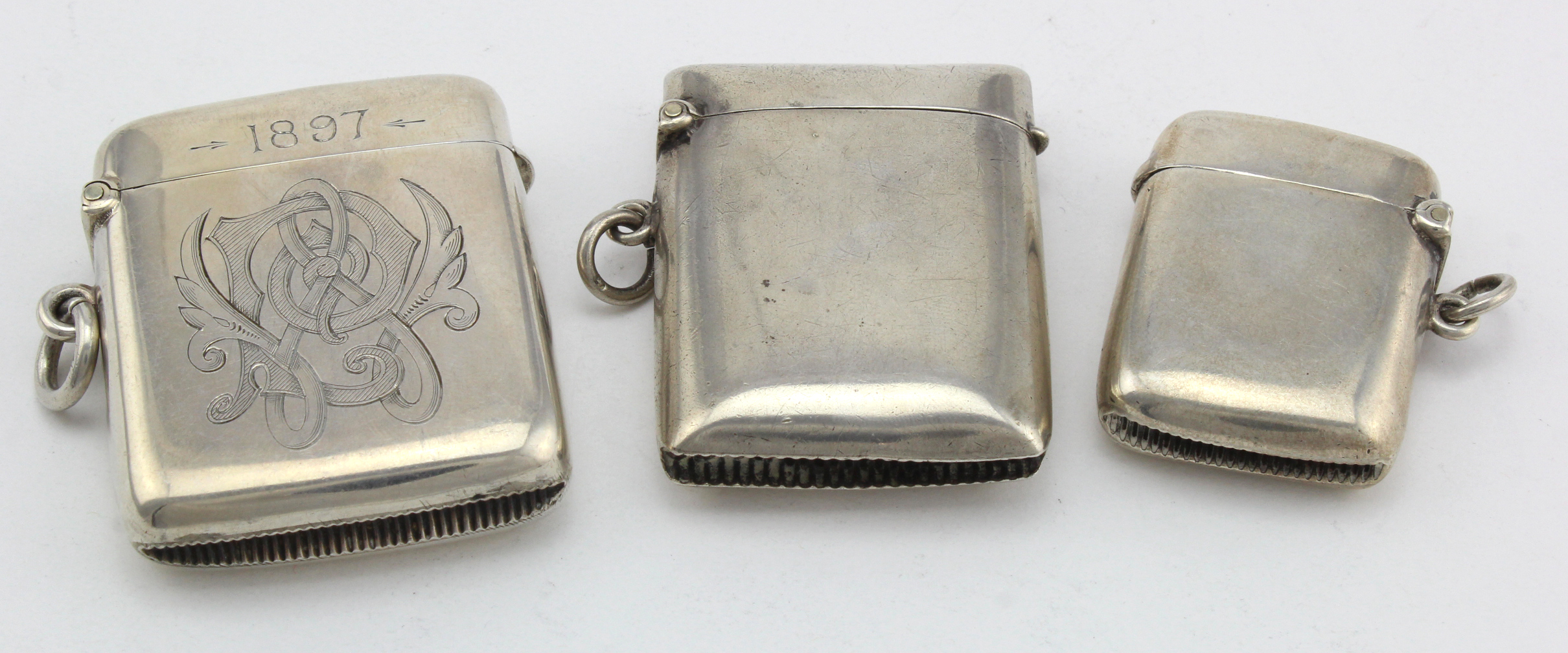 Three silver vesta cases, various makers & dates, includes one initialled Victorian example