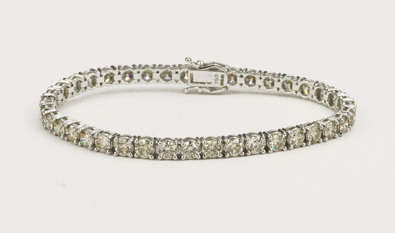 White gold (tests 18ct) diamond tennis bracelet, total diamond weight approx 9ct, thirty-nine