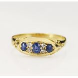 Yellow gold (tests 18ct) Victorian sapphire and diamond ring, three graduating sapphires principle