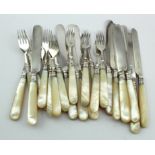 Twelve pairs of mother of pearl & silver fruit knives & forks in pretty good condition apart from