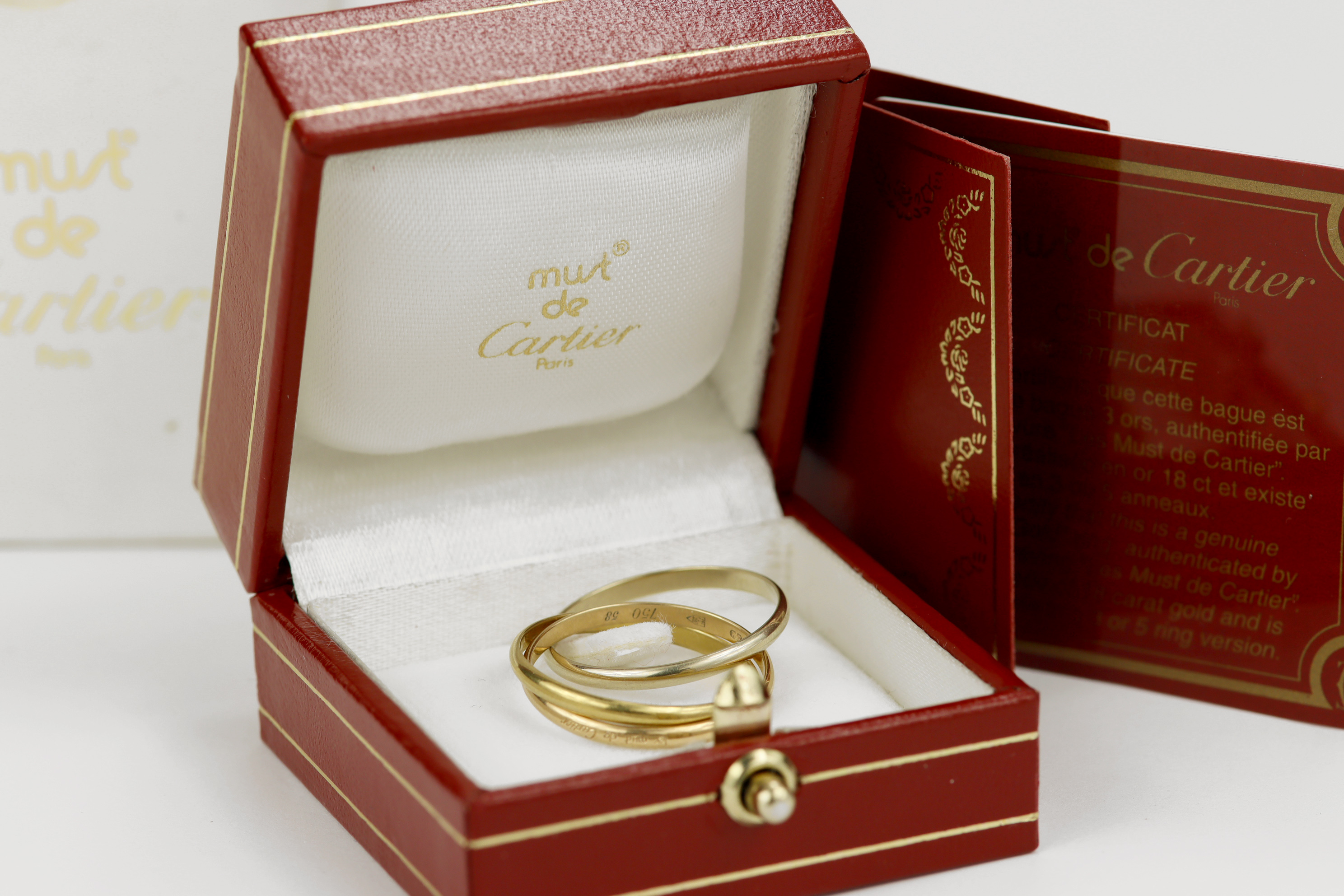 18ct Cartier 'Trinity' ring, classic 'Russian' wedding ring made up of yellow, white and rose gold - Image 2 of 2