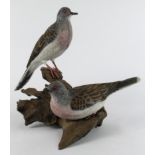 Mike Wood. A carved wood sculpture by Mike wood, titled to base 'Turtle Doves' (12/2001),