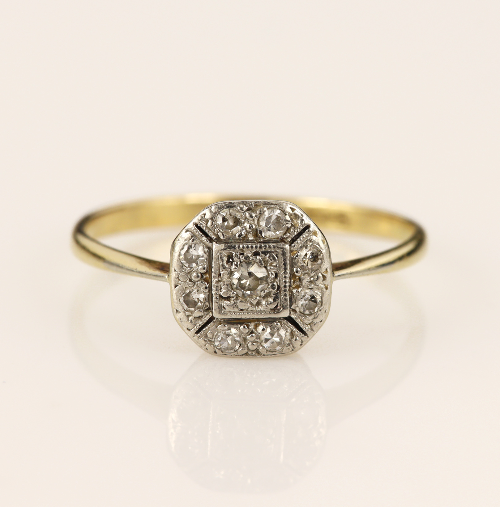 Yellow gold (tests 18ct) Vintage diamond cluster ring, halo cluster highlighted with single cut