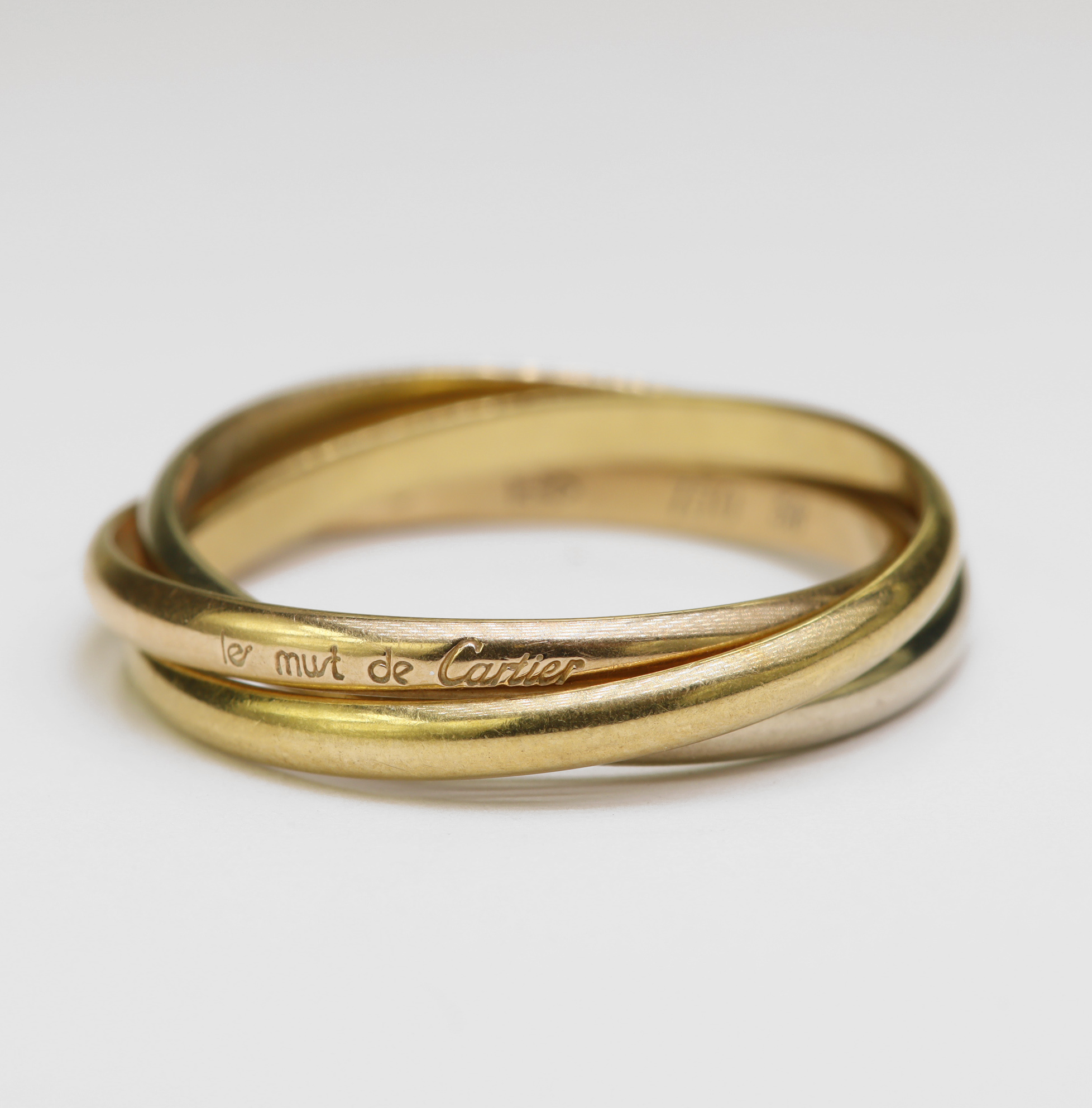 18ct Cartier 'Trinity' ring, classic 'Russian' wedding ring made up of yellow, white and rose gold