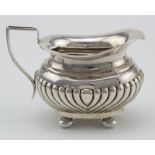 Small silver Queen Anne style cream jug on four ball feet weighs 3oz approx.