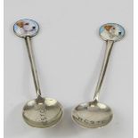 Teaspoons. Two novelty silver & enamel teaspoons, both depicting dogs heads (terriers),