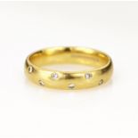 18ct yellow gold diamond scatter ring, seven round brilliant cut diamonds total weight approx 0.