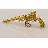 Yellow metal (tests as approx 18ct) pocket watch key in the form of a colt revolver. Approx 3.2g