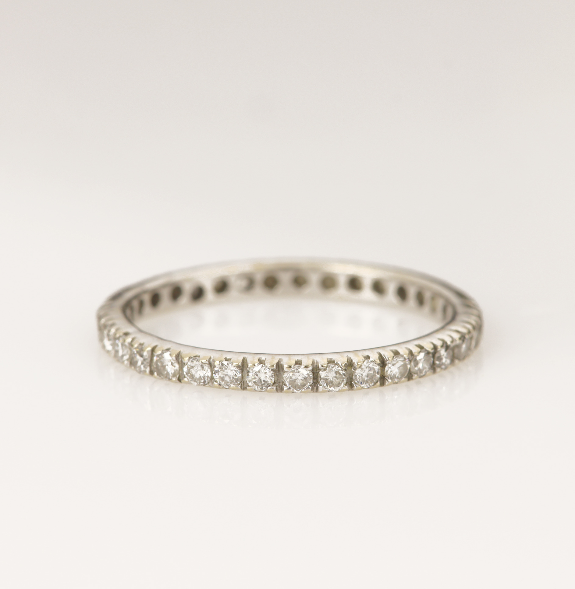 White gold (tests 18ct) diamond full eternity ring, set with thirty-five round brilliant cut