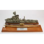WWI wooden model of a gunboat with moveable guns, mounted on a wooden plinth, total height 20cm,