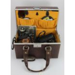 Photography interest. A case containing various photography equipment, including a Canon A-1