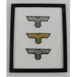 German framed collection of cloth officers breast badges.