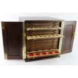 Coin Cabinet: Large mahogany, 28-tray coin cabinet by Peter Nichols, with spaces of various sizes.