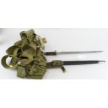 ME Co Webbing set with a P'07 Bayonet and Frog, and ammunition pouches, plus belt. Belt marked "