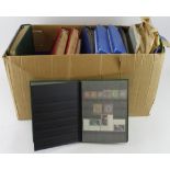 Large box of material including 3x albums of used World, two of GB um and used, two of FDC's and