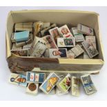 White shoebox with a quantity of Cigarette Card sets and part sets in bundles. (Qty)