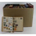 Large and very heavy box of World material in various albums / stockbooks, and two one country