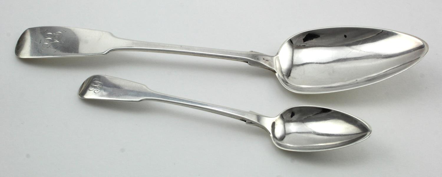 Two Channel Islands silver spoons comprising a silver fiddle pattern tablespoon by Jacques Quesnel