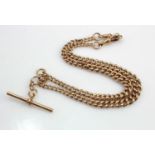 Rose gold (tests 9ct) double Albert chain with T-bar, graduation curb links, total length 16",