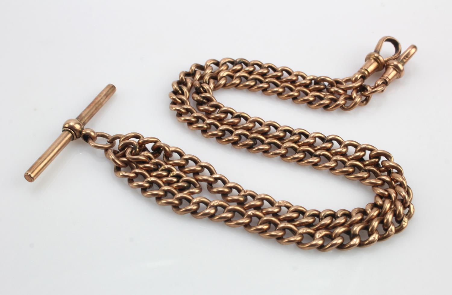 Rose gold (tests 9ct) double Albert chain with T-bar, length 18", weight 20.1g.