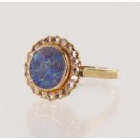 Yellow gold (tests 18ct) black opal triplet dress ring, opal triplet diameter 9.5mm, surrounded by a