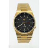 Gents gold plated Seiko 5 automatic wristwatch. Working when catalogued and on its original