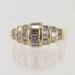 Yellow gold (tests 14ct) diamond dress ring, set with princess cuts and baguette cuts, TDW approx