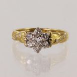 18ct yellow gold diamond daisy cluster ring, principle diamond approx 0.12ct, surrounded by six 0.