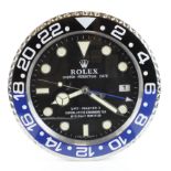 Advertising Wall Clock. Black & Blue (Batman) 'Rolex' style advertising wall clock, black dial reads