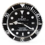 Advertising Wall Clock. Black 'Rolex' style advertising wall clock, black dial reads 'Rolex Oyster