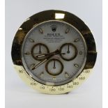 Advertising Wall Clock. Gold & white 'Rolex' style advertising wall clock, white dial reads 'Rolex