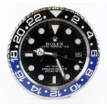 Advertising Wall Clock. Black & Blue (Batman) 'Rolex' style advertising wall clock, black dial reads