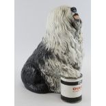 Beswick Dulux dog figure, depicting an old English Sheep dog resting their paw on a pot of Dulux