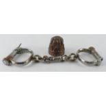 Hiatt steel handcuffs (key present), together with a small copper jelly mould, diameter 55mm